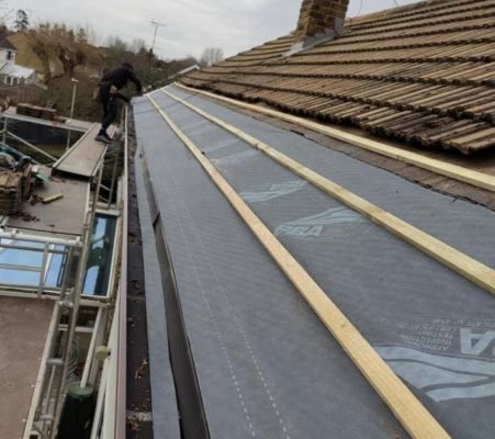 Roofing underlayment installation for a residential roof in Guildford, UK by experienced roofers.