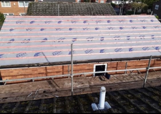 Fully stripped and weatherproofed roof ready for new tiles in Guildford, UK by professional roofers.